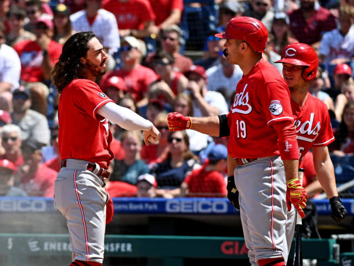 Aug 15, 2021; Philadelphia, Pennsylvania, USA; Cincinnati Reds third baseman Jonathan India (left) and first baseman Joey Votto (19) celebrate after India scored a run against the Philadelphia Phillies during the third inning at Citizens Bank Park.